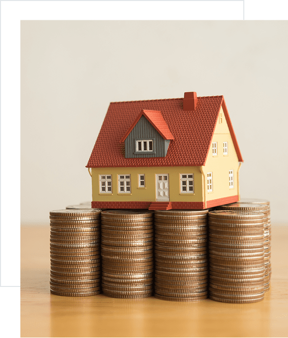 House model on stacked coins