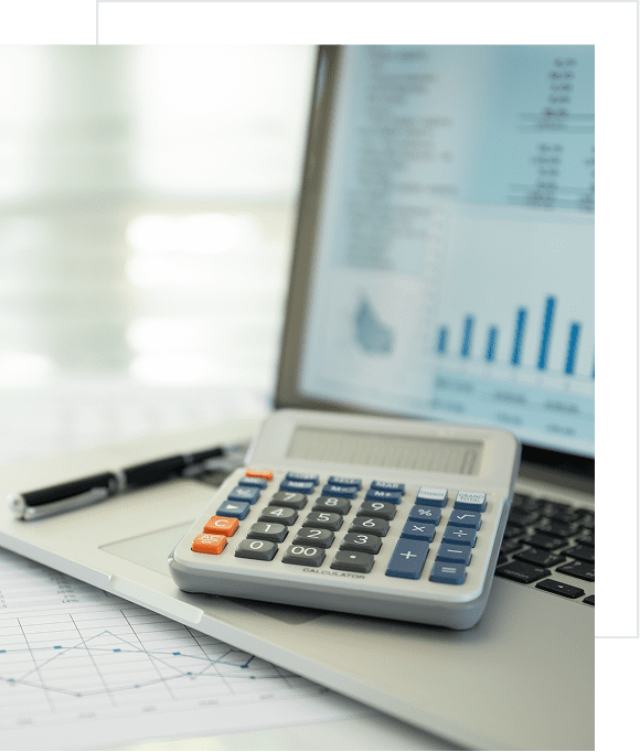 Business workspace with calculator and laptop